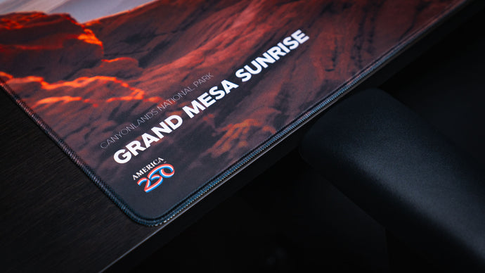 Close-up of precision stitching along a deskmat edge