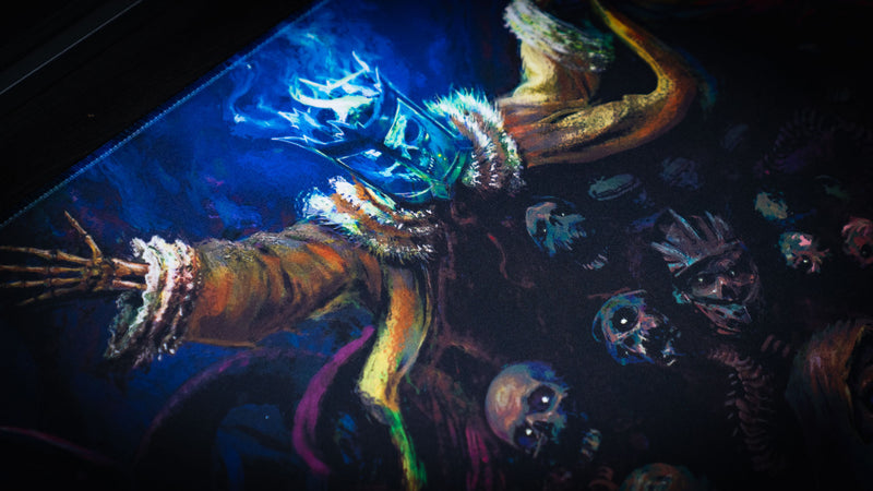 Close view of blue spectral monster and skull artwork on the Grim Kleeper Dominion of the Dark desk mat