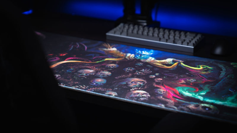 Low angled view of the Grim Kleeper Dominion of the Dark desk mat with neon creature artwork