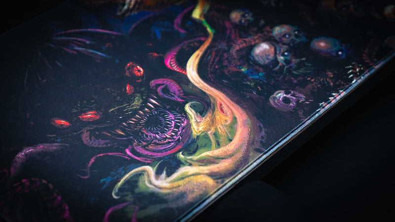 Close detail of skulls and swirling neon flames on the Dominion of the Dark desk mat