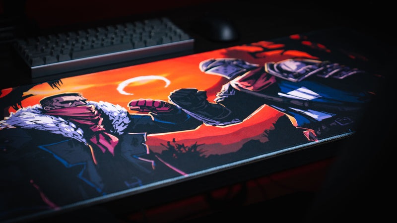 Angled view of the Redemption on the Old Road desk mat with two heroes meeting under an eclipse