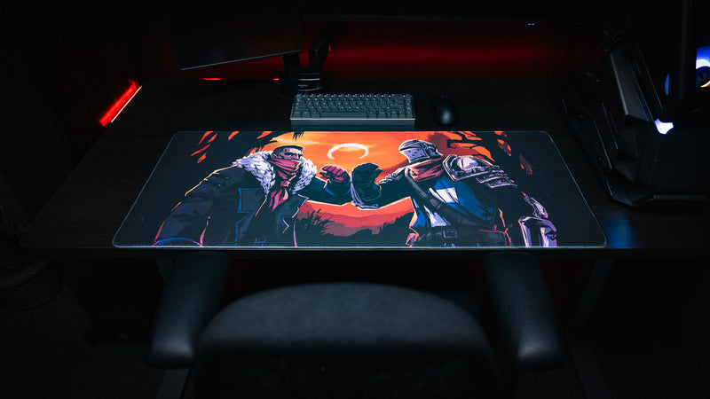 Centered gaming setup featuring the Grim Kleeper Redemption on the Old Road desk mat