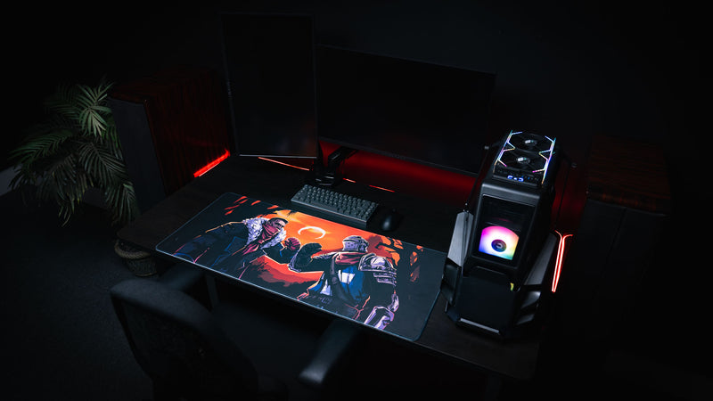 Wide dark PC setup featuring the Grim Kleeper Redemption on the Old Road gaming desk mat