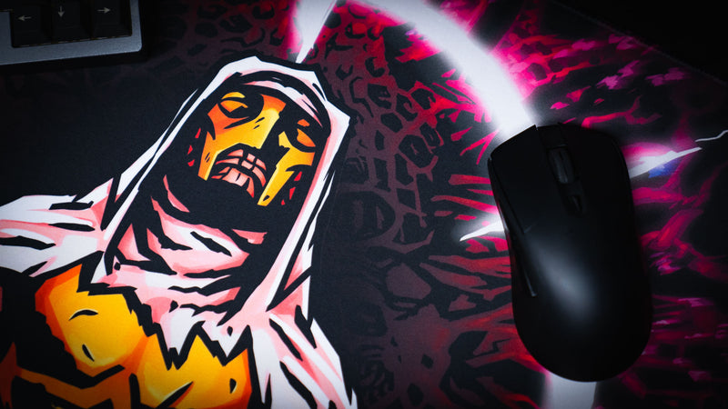 Close view of the hooded crusader face beside a mouse on the Grim Kleeper Spare Them desk mat