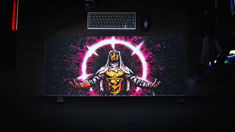 Overhead desk setup featuring the Grim Kleeper Spare Them gaming desk mat beneath a keyboard