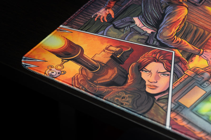 Close-up of the Head Hunters deskmat's stitched corner and comic panel showing a red-haired operator aiming a gun.