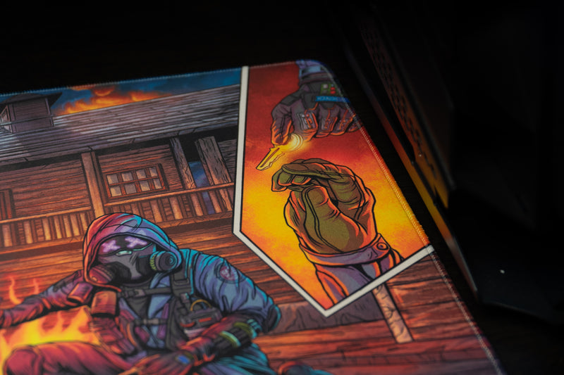 Head Hunters deskmat detail showing a masked operator and an orange comic panel with gloved hands passing a key.
