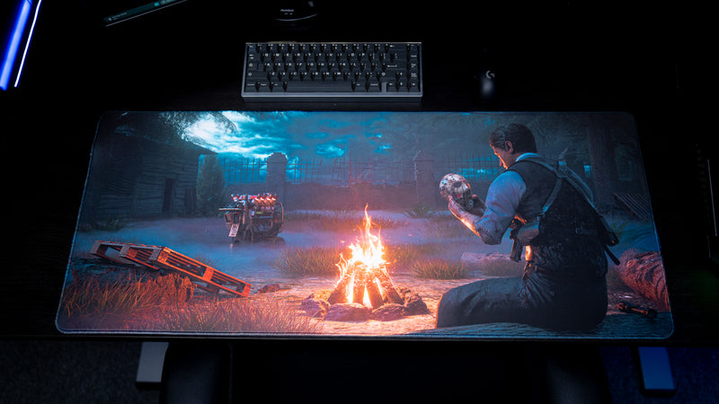 Top view of Hens The Last Campfire deskmat displaying the full campfire scene below a keyboard and mouse.