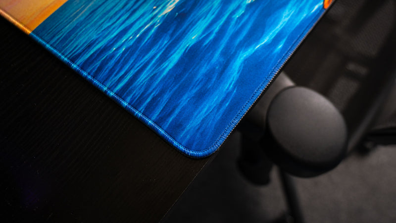 Close-up of the How Do You F@#K Do You Fish deskmat by Posty showcasing vibrant ocean artwork, premium stitched edges, and smooth gaming surface texture.