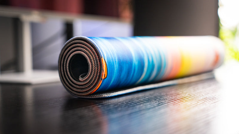 Rolled How Do You F@#K Do You Fish deskmat by Posty showcasing vibrant sunset ocean artwork, premium stitched edges, and flexible anti-curl construction.