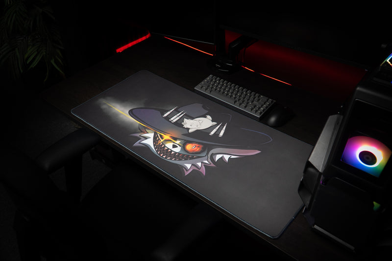 Iddqd Chonk Mat deskmat in a gaming setup with red lighting, a keyboard, and an RGB-lit PC.