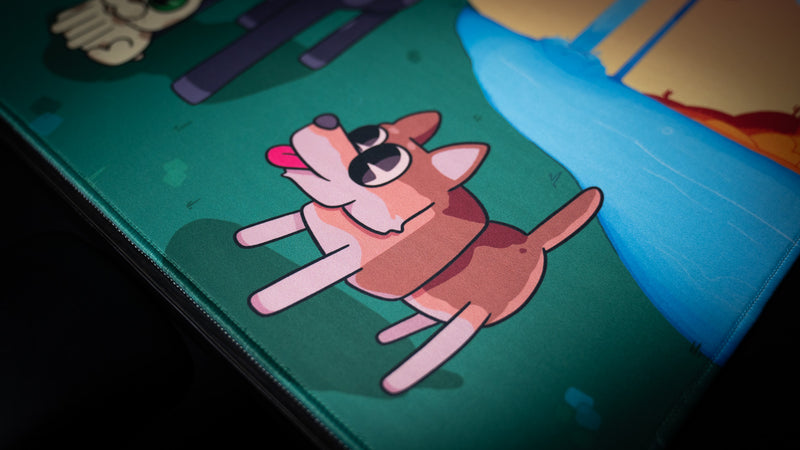 Close-up of the dog artwork and blue river on ItzOutlaw's Glorious Victory desk mat