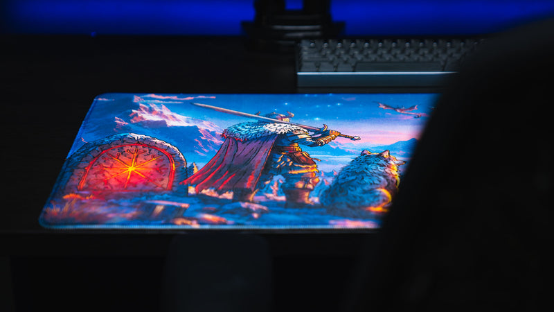 Low-angle view of the warrior and glowing red rune gate on the Jakk Frost Hold desk mat