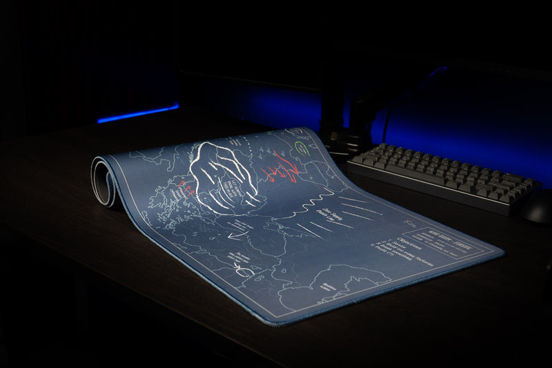 Partially rolled Jaush Vague Concepts of a Plan deskmat showing the blue strategy map and objectives panel.