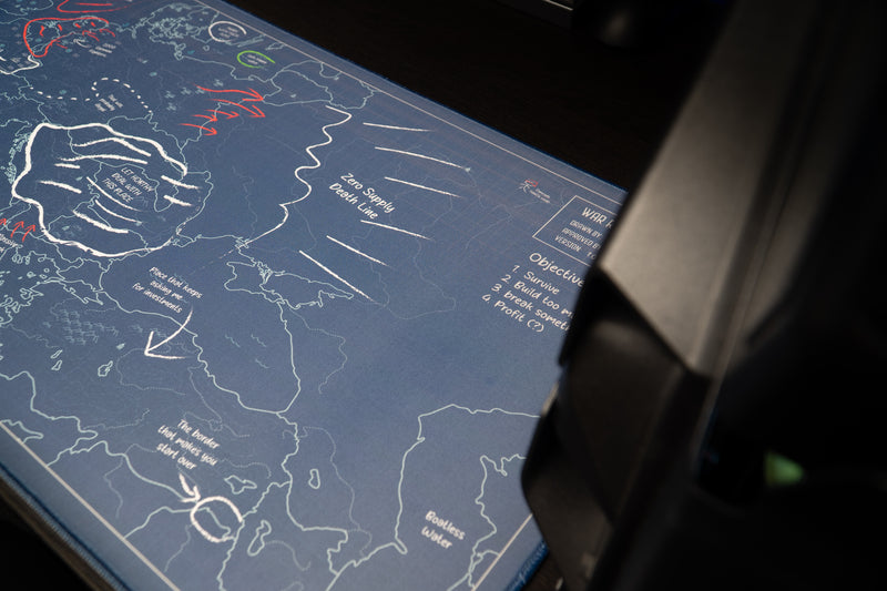 Close-up of the Jaush deskmat's eastern European map with handwritten arrows and the words Zero Supply Death Line.