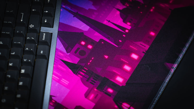 Keyboard and neon castle artwork detail on Jillyeon's Chroma Kingdom deskmat