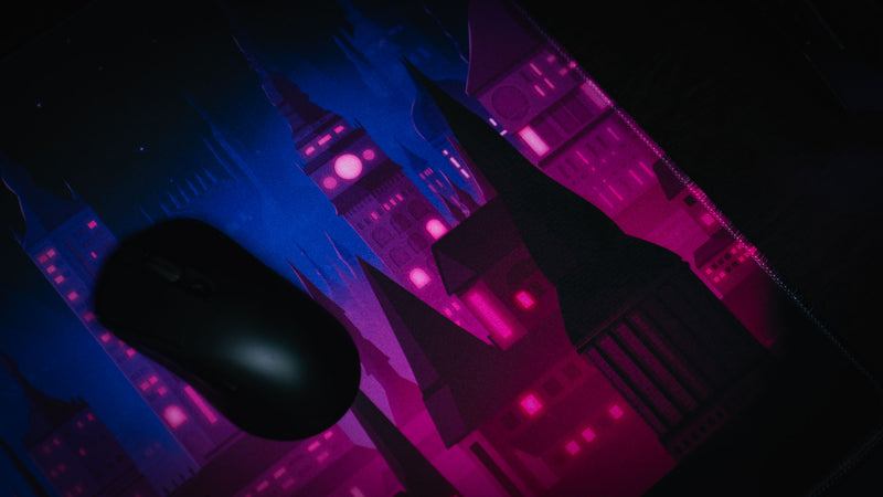Mouse on the smooth Chroma Kingdom deskmat surface with blue castle artwork