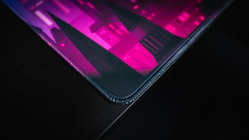 Close-up of the stitched corner on Jillyeon's Chroma Kingdom deskmat