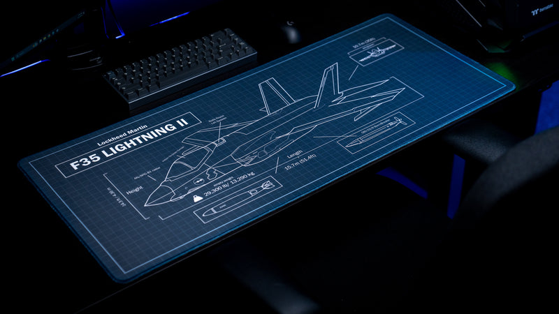 Angled view of the Jimarkus F35 Schematic deskmat showcasing a detailed Lockheed Martin F-35 Lightning II blueprint with technical callouts and measurements.