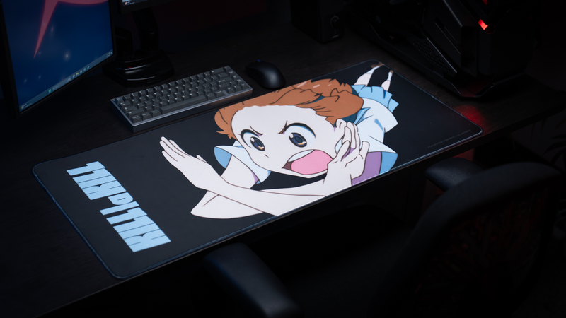 Premium gaming setup featuring the Kill la Kill “Mako’s Fury” anime deskmat with energetic character artwork, keyboard, and gaming mouse.