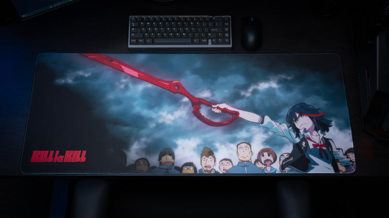 Kill la Kill anime gaming deskmat featuring Ryuko wielding the Scissor Blade beneath stormy skies with dramatic character artwork and crowd scene.