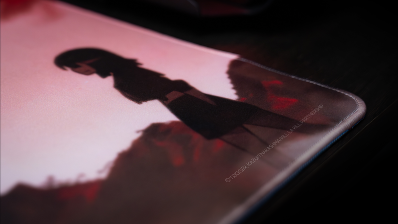 Close-up of the Kill la Kill “The First Duel” deskmat featuring stitched edges, soft fabric texture, and silhouetted anime character artwork