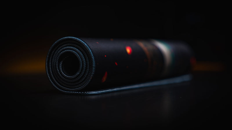 Rolled Last Man Standing official Rust gaming deskmat showcasing its premium cloth surface, durable stitched edges, and anti-slip rubber base.