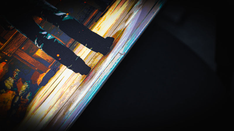 Close-up of the Last Man Standing official Rust gaming deskmat highlighting premium stitched edges, detailed cabin floor artwork, and high-definition print quality.