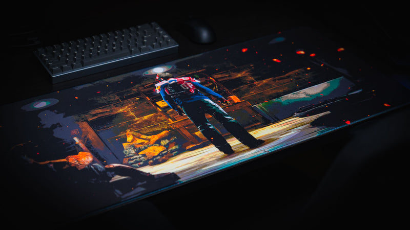 Angled view of the Last Man Standing official Rust gaming deskmat featuring a lone survivor standing inside a dimly lit base before the final battle.