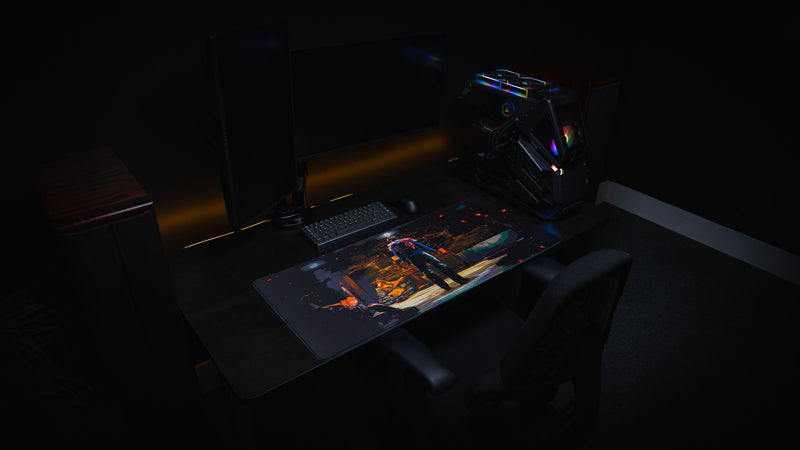 Last Man Standing official Rust gaming deskmat displayed on an RGB gaming setup featuring a lone survivor standing inside a dimly lit base.