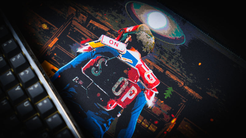 Close-up of the Last Man Standing official Rust gaming deskmat featuring the lone survivor from behind inside a dimly lit base, preparing for the final battle.