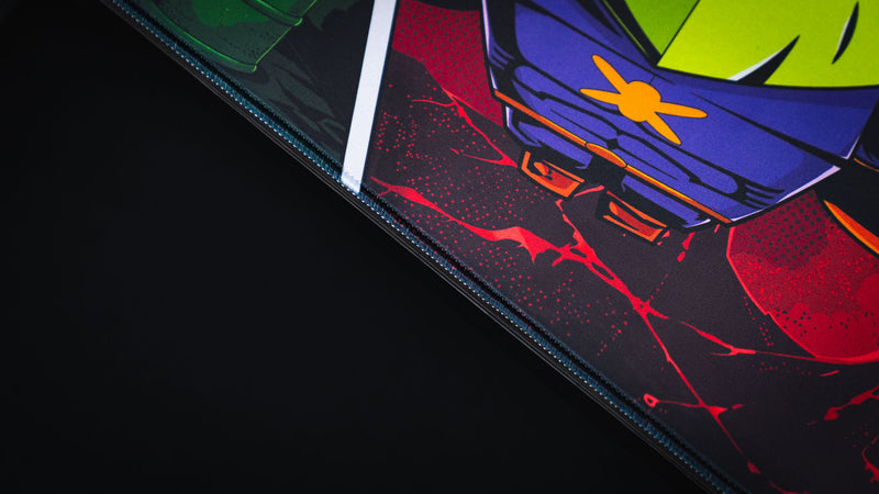 Close-up of the Lure of the Night gaming deskmat highlighting the stitched edge, premium cloth surface, and colorful comic-inspired Rust artwork.