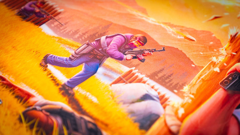 Close-up of the main scene Rust deskmat showcasing an advancing raider during a firefight, highlighting the detailed artwork, vivid colors, premium print quality, and smooth stitched-edge gaming mouse pad surface.