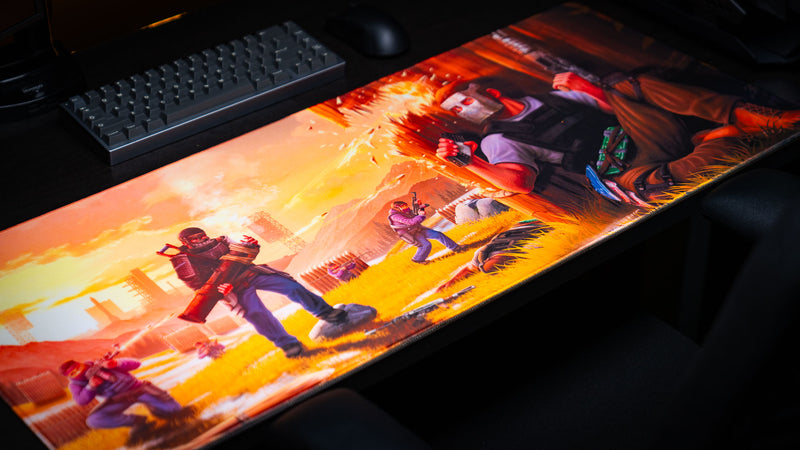 main scene Rust deskmat displayed in a complete gaming setup with a mechanical keyboard and gaming mouse, showcasing the full firefight artwork, vibrant colors, premium print quality, and stitched-edge XXL gaming mouse pad.