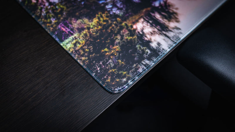 Close-up of the Mount Moran deskmat highlighting premium stitched edges, vibrant Grand Teton National Park photography, and a durable gaming surface.