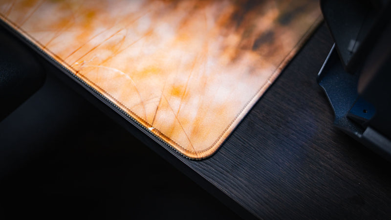 Close-up of the Mule Deer Buck premium gaming deskmat highlighting the precision stitched edge, smooth fabric surface, and durable premium construction.