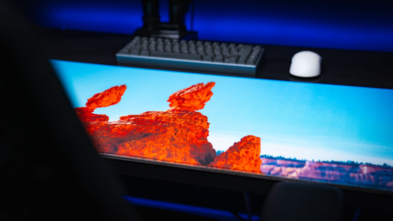 Close-up of the Navajo Loop Trail deskmat featuring Bryce Canyon's iconic Thor's Hammer hoodoo with vivid HD photography, premium stitched edges, and a smooth gaming surface