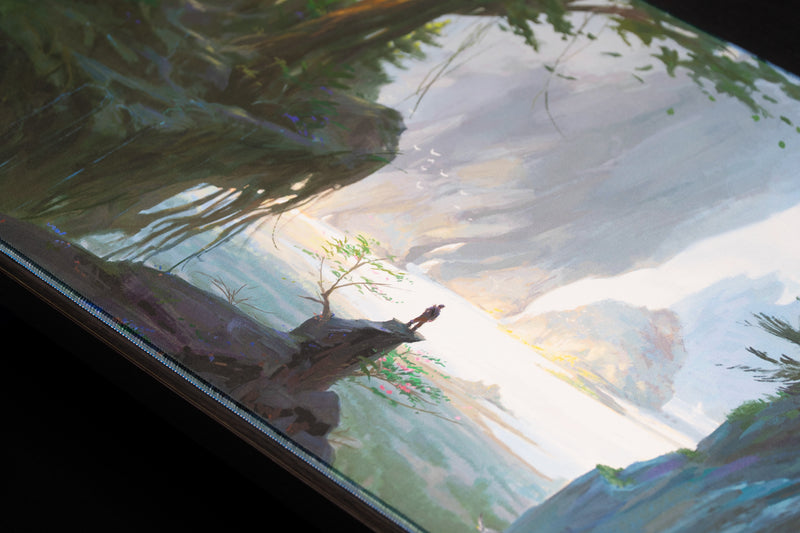 Close-up of the Lake of Laugg deskmat showing a lone traveler by the misty lakeshore and stitched edge