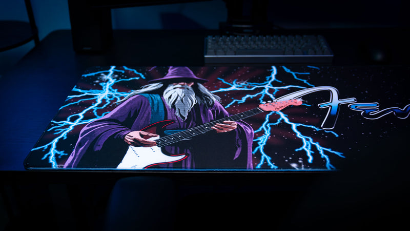 Fender Electric Spellcaster desk mat with bold wizard guitarist artwork across an extended mouse surface