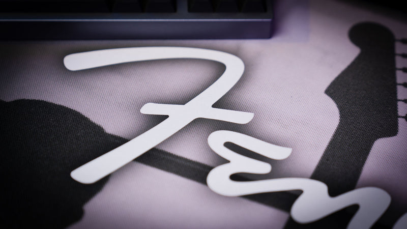 Angled view of the Fender Family Night Out 1954 XXL desk mat and classic grayscale design