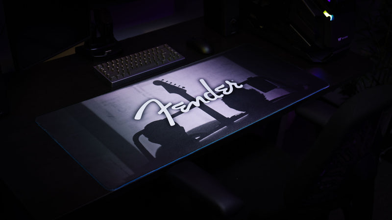 Fender Family Night Out 1954 desk mat featuring a silhouetted guitar beneath the classic Fender logo