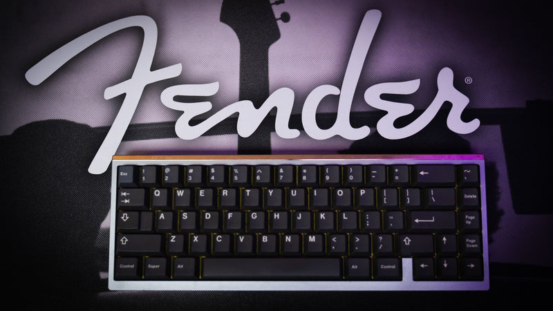 Detailed view of the silhouetted guitar and family moment on the Fender 1954 desk mat
