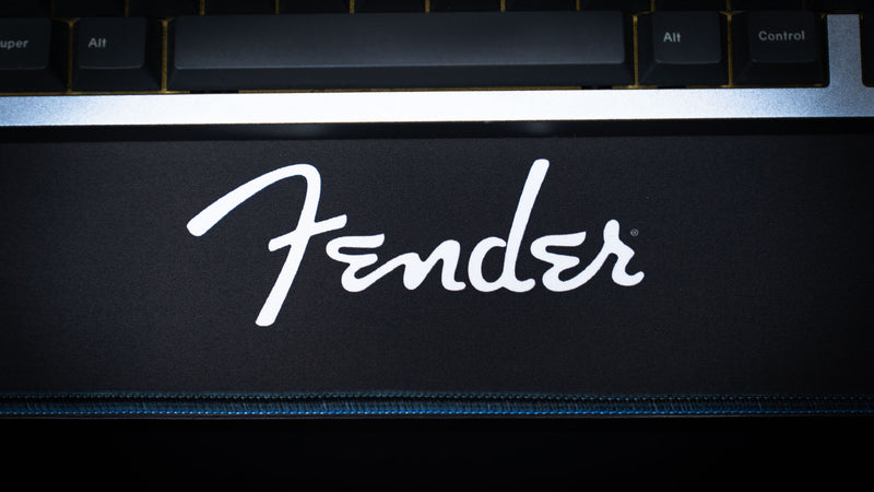 Black-and-white Fender Headstocks desk mat showing its extended surface for a keyboard and mouse