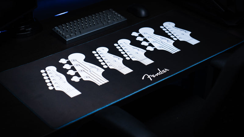Detailed view of the Fender Headstocks desk mat artwork and high-contrast print