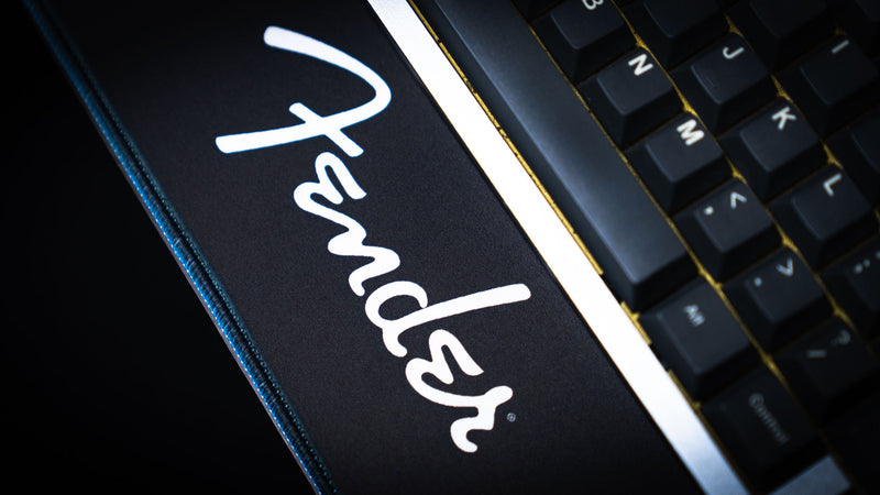 Fender Headstocks desk mat showing detailed line art across the smooth mouse surface