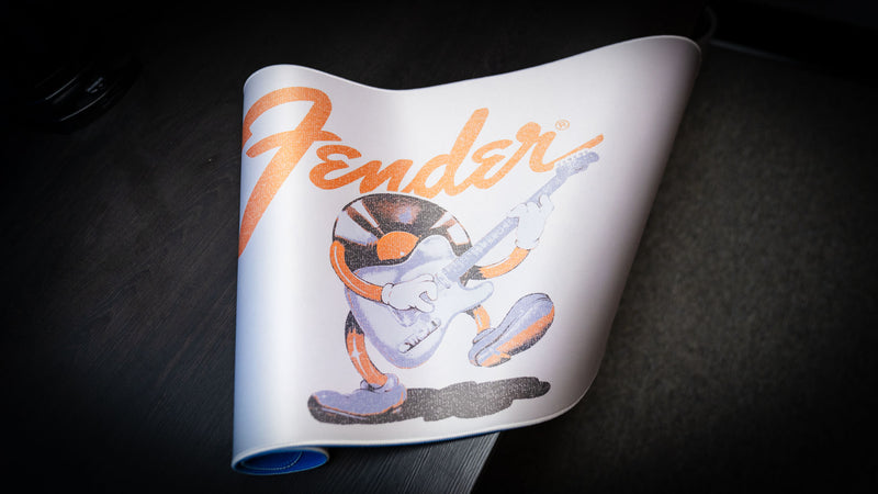 Angled view of the Fender Recording Machine XXL desk mat and its distressed vintage design