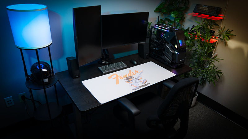 Fender Recording Machine desk mat with a playful guitar character and classic logo on soft cream