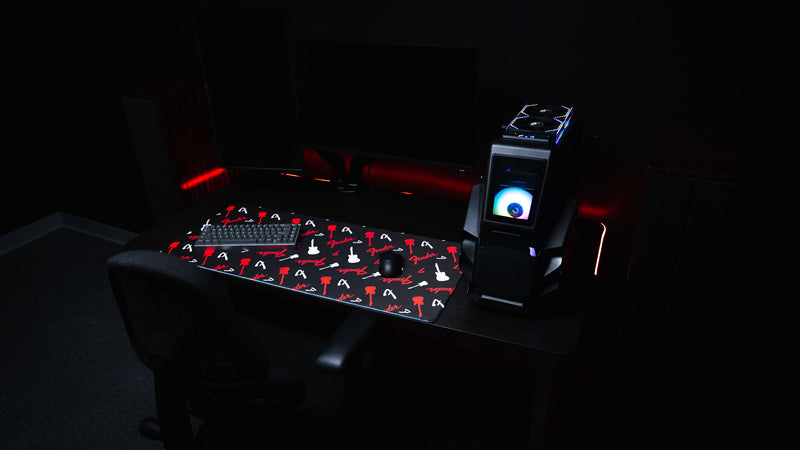 Fender Repeat desk mat showing bold red graphics across a deep black background
