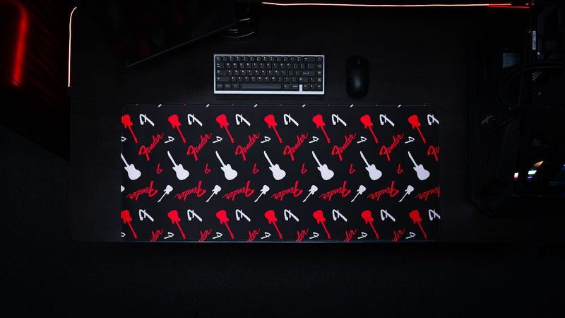 Fender Repeat desk mat featuring repeated red Fender graphics across a black surface
