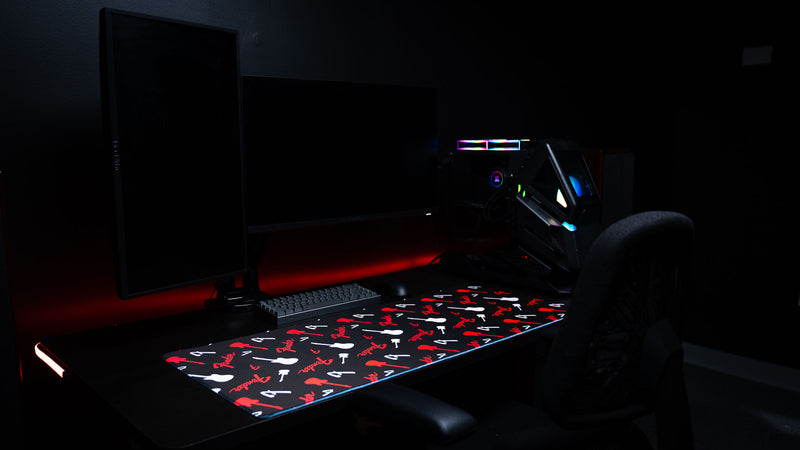 Wide desk setup view featuring the Fender Repeat XXL desk mat beneath workspace accessories
